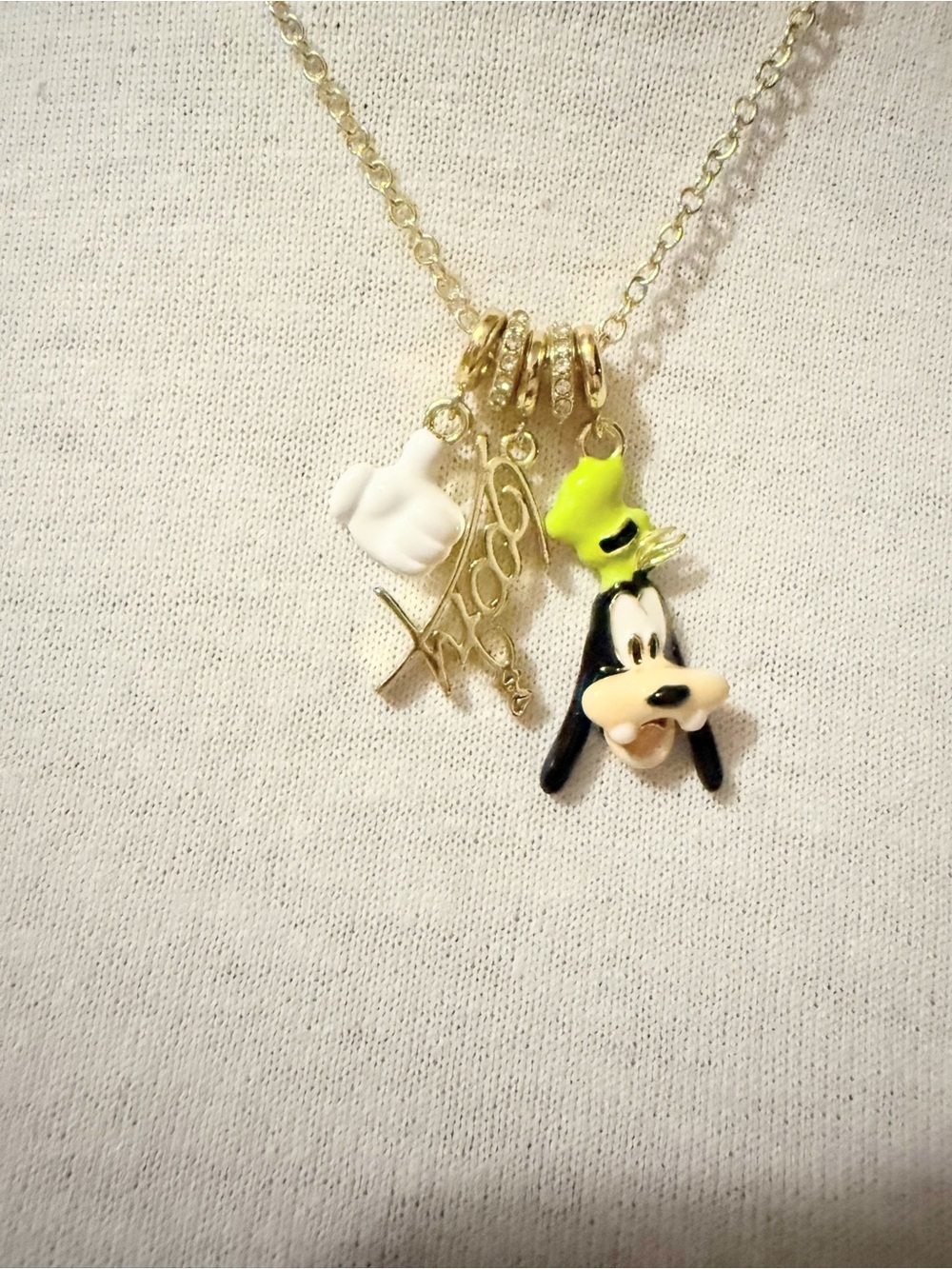 Gold-tone Necklace with Green and White Goofy Charm